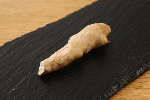 Raw ginger root on slate plate healthy food Foto stock