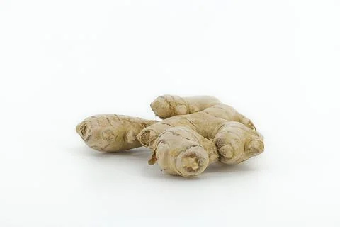 Raw ginger root on a white background, showing its detailed texture and nat.. Stock Photos