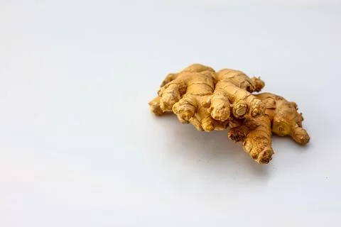 Raw Ginger Root on a White Background Stock Photos