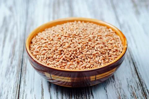 Raw grain in a plate Stock Photos