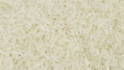 Raw grains of rice, rotating background - top view. Stock Footage 204074611