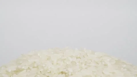 Raw grains of rice, rotating background - side view, close-up. Copy space Stock Footage 204075066
