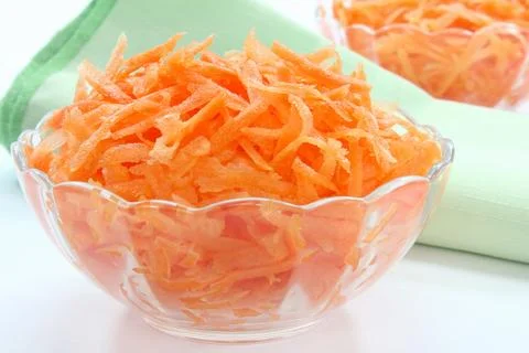 Raw grated carrots Stock Photos