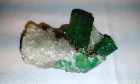 Raw Green Emerald Crystals Emerging From Natural White Quartz Matrix Stock Photos