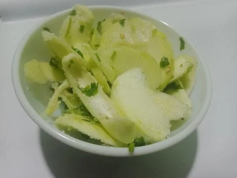 Raw green mango slices. Delicious taste as a salad mix Stock Photos