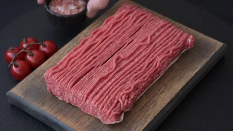 Raw ground beef or pork with salt, spices, herbs and tomatoes 動画素材 292662478
