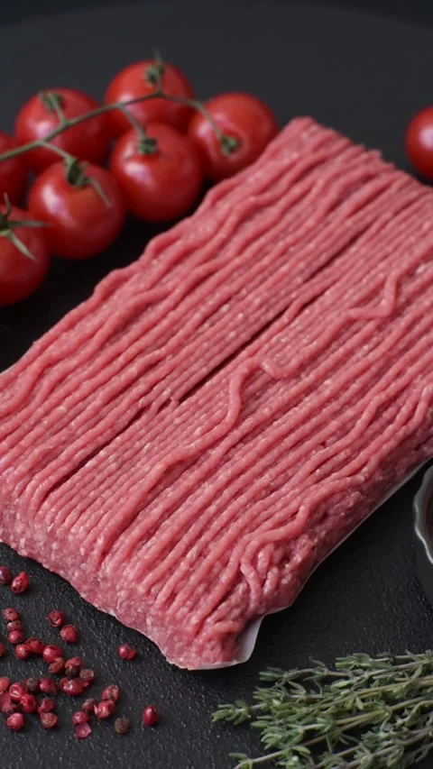 Raw ground beef or pork with salt, spices, herbs and tomatoes 動画素材 292662484