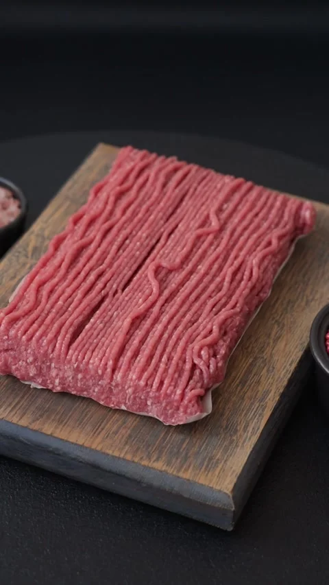 Raw ground beef or pork with salt, spices, herbs and tomatoes 動画素材 292662487