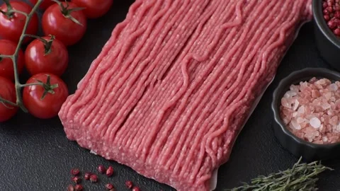 Raw ground beef or pork with salt, spices, herbs and tomatoes 動画素材 292662494