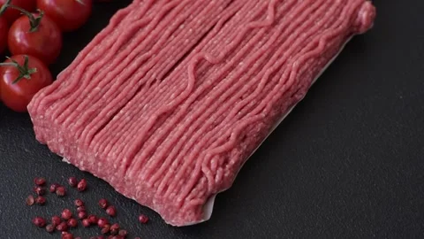 Raw ground beef or pork with salt, spices, herbs and tomatoes 動画素材 292662495
