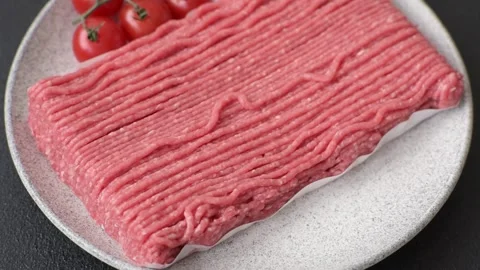 Raw ground beef or pork with salt, spices, herbs and tomatoes 動画素材 292662503