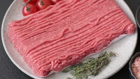 Raw ground beef or pork with salt, spices, herbs and tomatoes 動画素材 292662505
