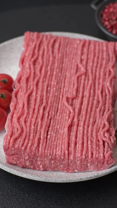 Raw ground beef or pork with salt, spices, herbs and tomatoes 動画素材 292662517