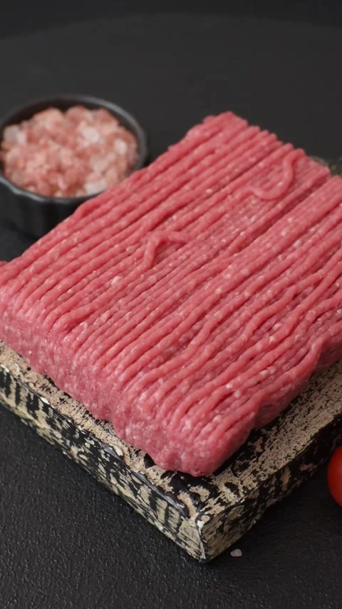 Raw ground beef or pork with salt, spices, herbs and tomatoes 動画素材 292662536