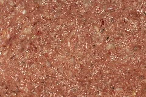 Raw ground beef texture with natural spices for culinary preparation Stock Photos