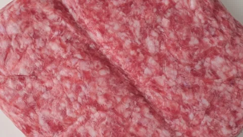 Raw ground pork meat texture top view rotating Stock Footage 346177968