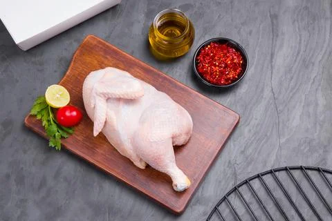 Raw half chicken with skin Stock Photos