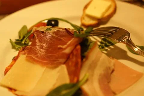Raw ham and fork Stock Photos