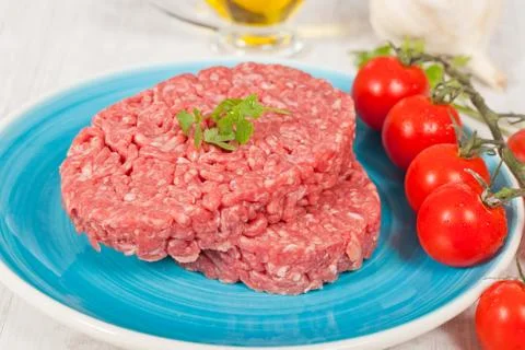 Raw hamburger Stock Photos