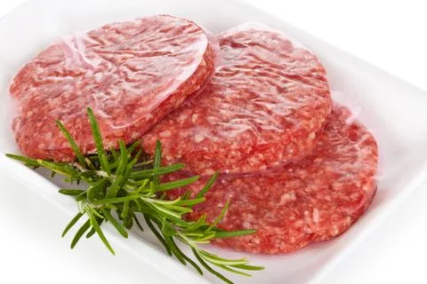 Raw hamburgers. Stock Photos