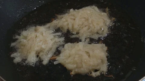 Raw hash browns spread in the pan top view Stock Footage 108006803