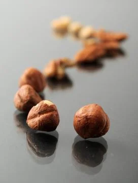 Raw hazelnuts chestnuts Stock Photos
