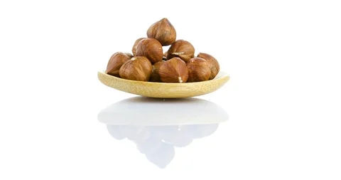 Raw hazelnuts isolated on white background Stock Footage 102809107