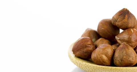 Raw hazelnuts isolated on white background Stock Footage 102809403