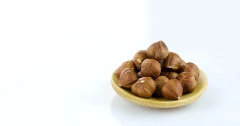 Raw hazelnuts isolated on white background Stock Footage 102811564