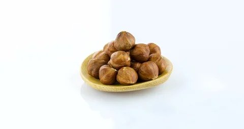 Raw hazelnuts isolated on white background Stock Footage 102811791