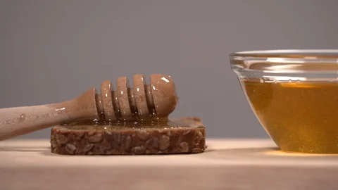 Raw Honey and a Slice of Bread Stock Footage 110848675