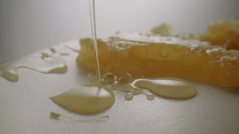 Raw Honey dripping with Honeycomb Stock Footage 282645357