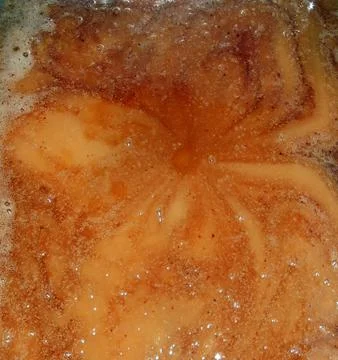 Raw honey in full processing Stock Photos