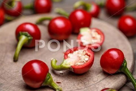 Raw hot cherry peppers Stock Photos