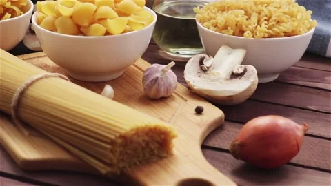 Raw ingredients for cooking pasta  on the table panning shot Stock Footage 111824439