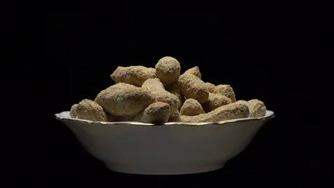 Raw Inshell Peanuts fried with salt.  Rotation. peanuts in shell. Stock Footage 102130213