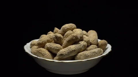 Raw Inshell Peanuts fried with salt.  Rotation. peanuts in shell. Stock Footage 102130615