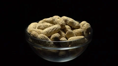 Raw Inshell Peanuts fried with salt.  Rotation. peanuts in shell. Stock Footage 102133479