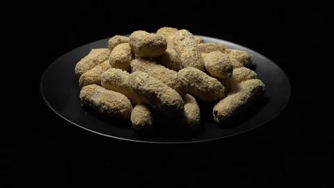 Raw Inshell Peanuts fried with salt.  Rotation. peanuts in shell. Stock Footage 102134781