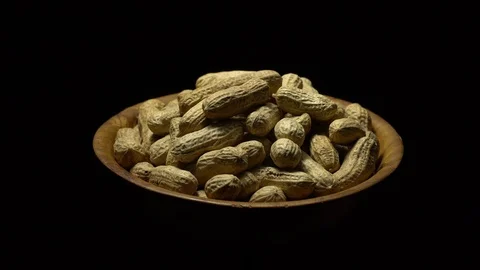 Raw Inshell Peanuts fried with salt.  Rotation. peanuts in shell. Stock Footage 102274095