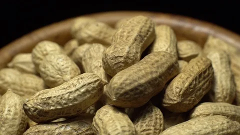 Raw Inshell Peanuts fried with salt.  Rotation. peanuts in shell. Stock Footage 102274344
