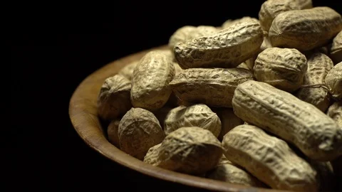Raw Inshell Peanuts fried with salt.  Rotation. peanuts in shell. Stock Footage 102274419