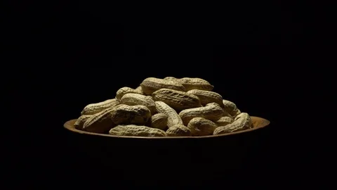 Raw Inshell Peanuts fried with salt.  Rotation. peanuts in shell. Stock Footage 102274561