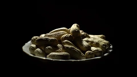 Raw Inshell Peanuts fried with salt.  Rotation. peanuts in shell. Stock Footage 102274617