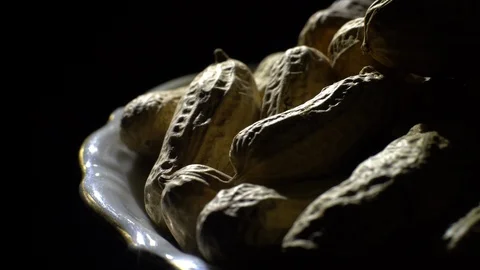 Raw Inshell Peanuts fried with salt.  Rotation. peanuts in shell. Stock Footage 102274646