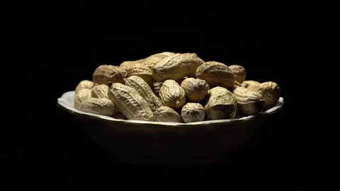 Raw Inshell Peanuts fried with salt.  Rotation. peanuts in shell. Stock Footage 102274830