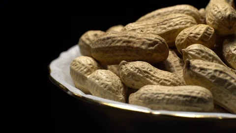 Raw Inshell Peanuts fried with salt.  Rotation. peanuts in shell. Stock Footage 102274941