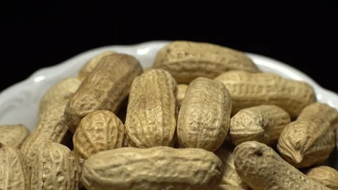 Raw Inshell Peanuts fried with salt.  Rotation. peanuts in shell. Stock Footage 102275019