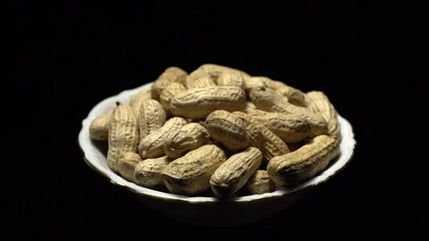 Raw Inshell Peanuts fried with salt.  Rotation. peanuts in shell. Stock Footage 102275038