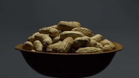 Raw Inshell Peanuts. Rotation. peanuts in shell. Snack closeup. Stock Footage 102270147
